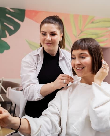 Hair stylist giving advise to customer